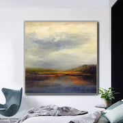 a painting hanging on a wall above a bed